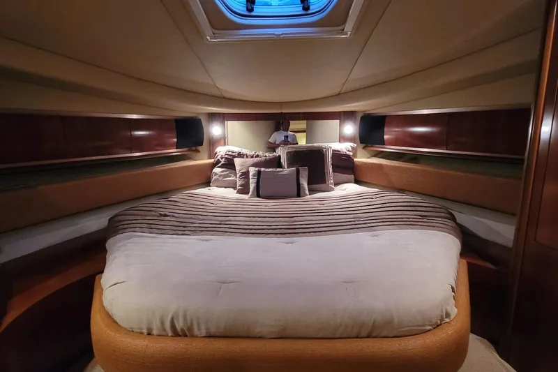 Blue Heaven Yacht Photos Pics Luxurious cabin interior of 2005 Sea Ray 500 Sundancer yacht with plush bedding.