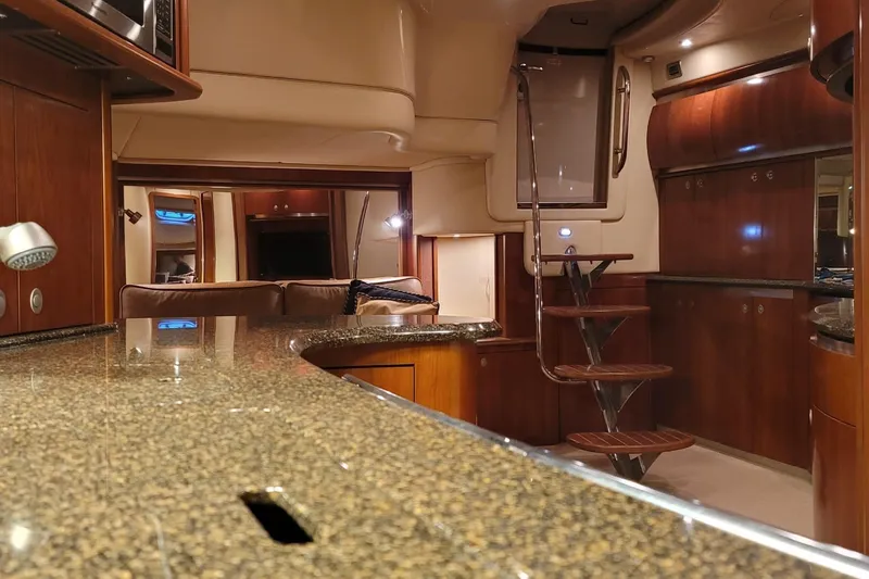Blue Heaven Yacht Photos Pics Luxurious interior of 2005 Sea Ray 500 Sundancer yacht with elegant wood finishes.