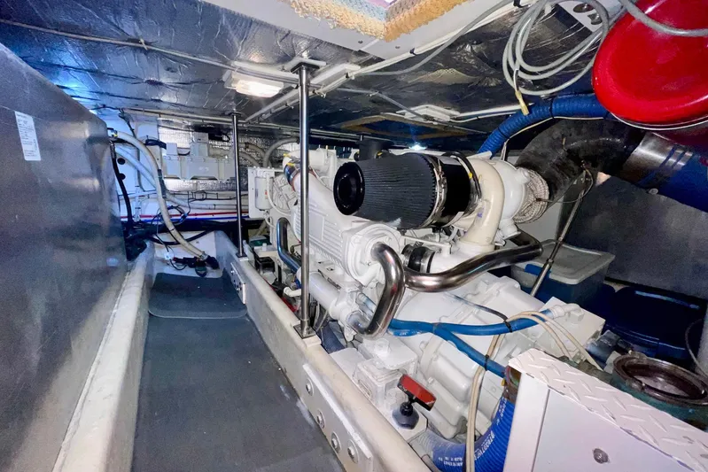 Slainte II Yacht Photos Pics Engine room of a 2008 Nordic Tug 42, showcasing mechanical components and wiring.