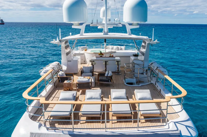 Allora Yacht Photos Pics Luxurious 2011 Benetti Classic 121 yacht deck with sun loungers and ocean view.
