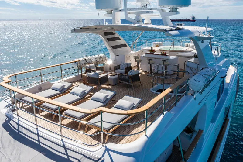 Allora Yacht Photos Pics Luxurious 2011 Benetti Classic 121 yacht deck with sun loungers and ocean view.