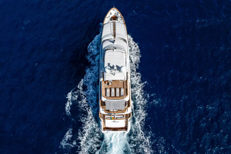 Allora Yacht Photos Pics Aerial view of 2011 Benetti Classic 121 yacht cruising in deep blue ocean.