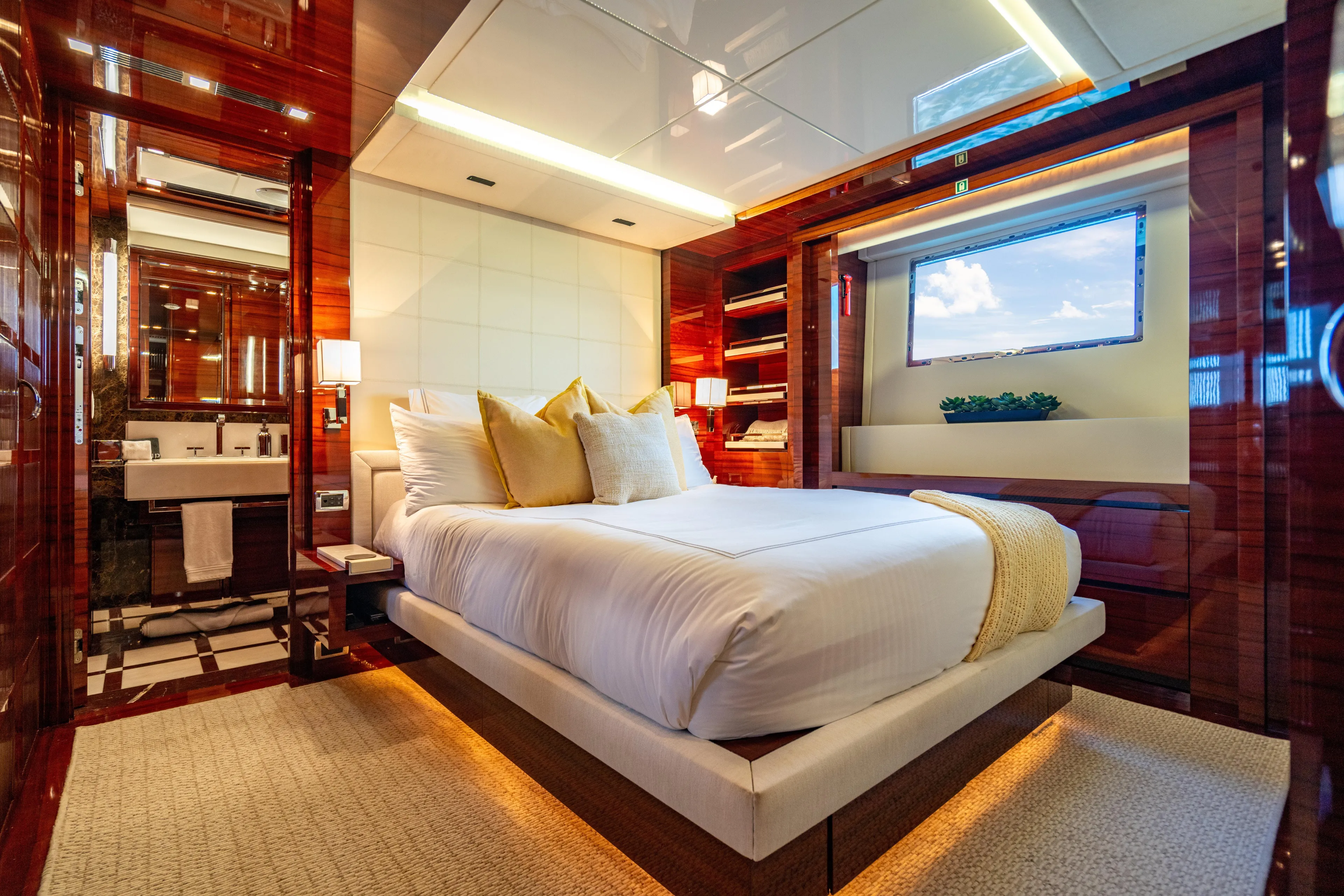 Allora Yacht Photos Pics Luxurious bedroom interior on 2011 Benetti Classic 121 yacht, featuring elegant wood finishes and modern design.