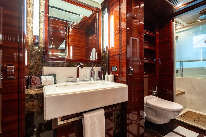 Allora Yacht Photos Pics Luxurious bathroom on 2011 Benetti Classic 121 yacht with elegant wood and marble finishes.
