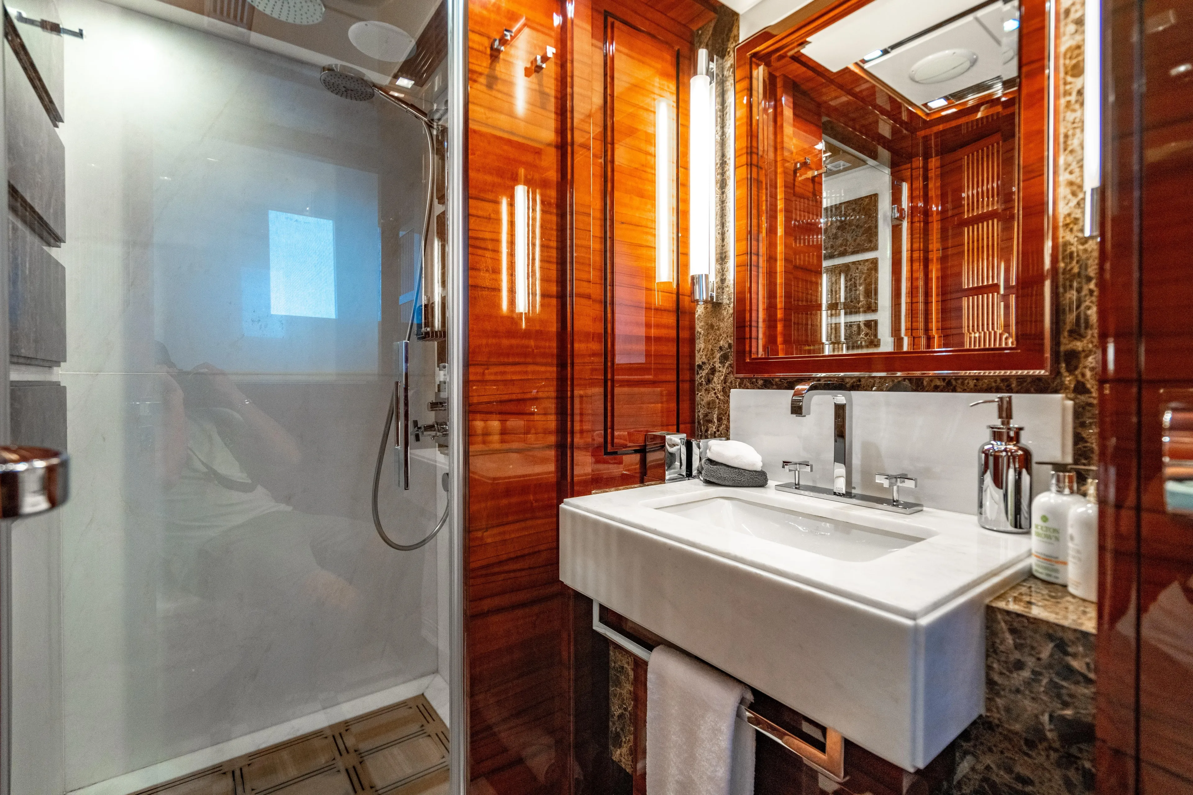 Allora Yacht Photos Pics Luxurious bathroom on 2011 Benetti Classic 121 yacht with elegant wood and marble finishes.