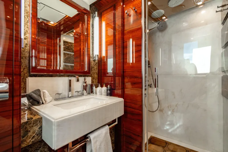 Allora Yacht Photos Pics Luxurious bathroom on 2011 Benetti Classic 121 yacht with elegant wood and marble finishes.