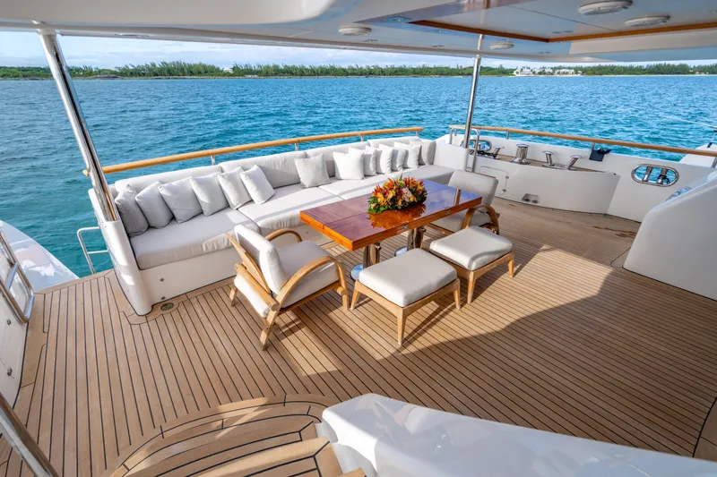 Allora Yacht Photos Pics Luxurious deck of 2011 Benetti Classic 121 yacht with elegant seating and ocean view.