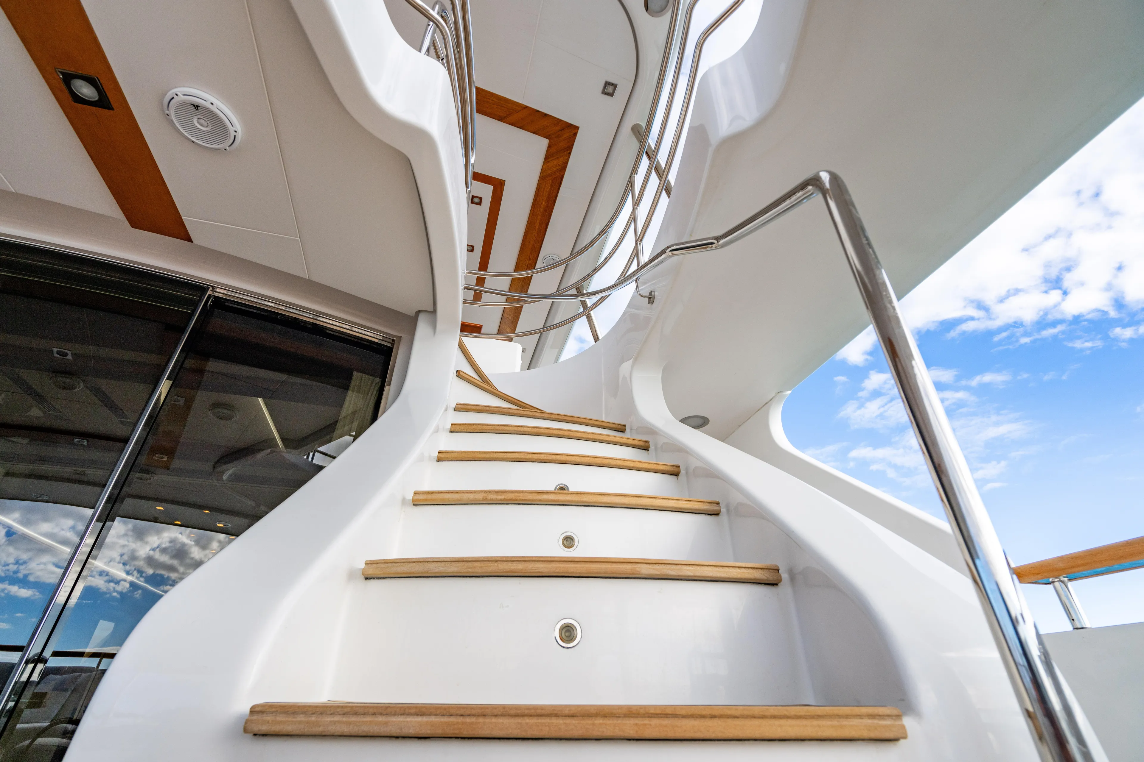 Allora Yacht Photos Pics Elegant staircase on 2011 Benetti Classic 121 yacht, featuring sleek design and modern architecture.