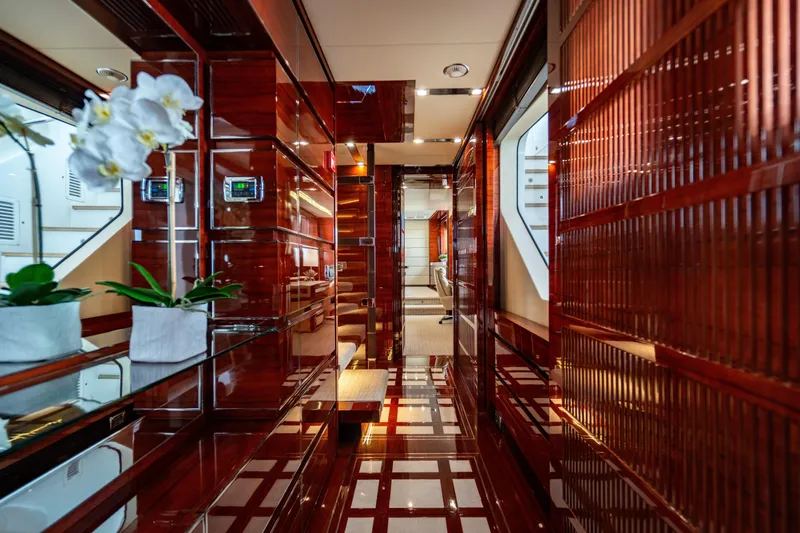 Allora Yacht Photos Pics Luxurious interior of 2011 Benetti Classic 121 yacht with polished wood and elegant decor.