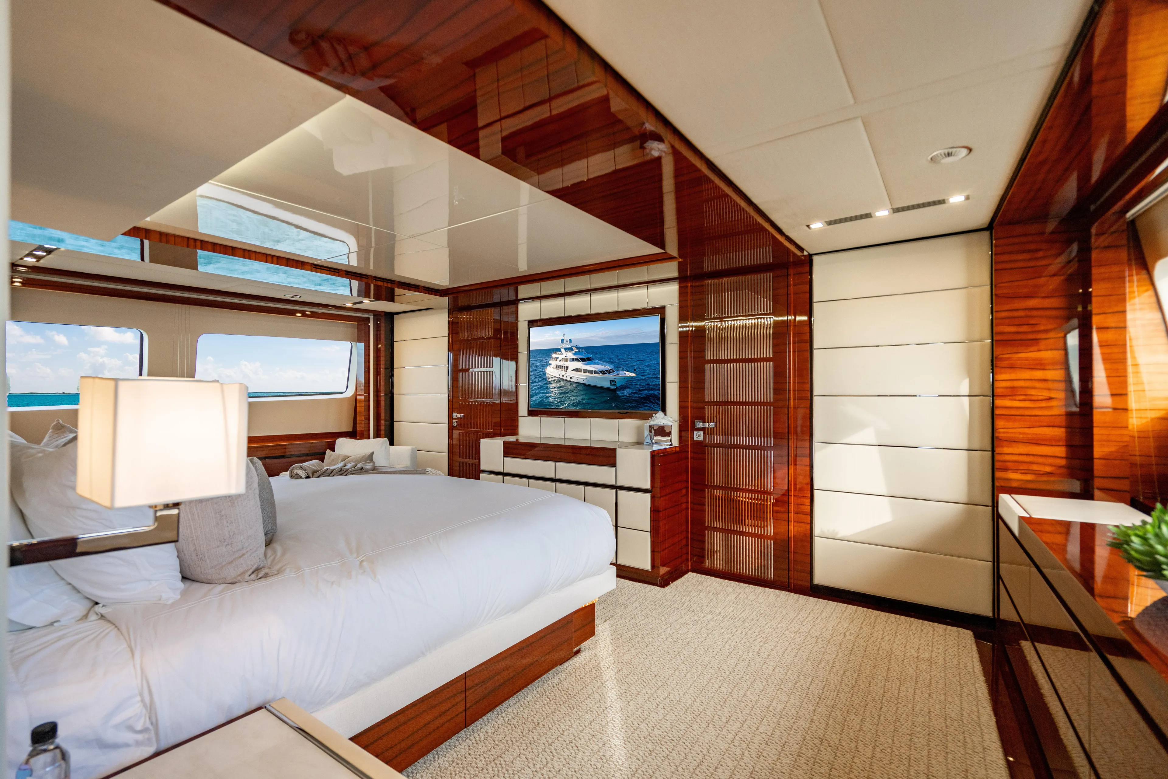Allora Yacht Photos Pics Luxurious bedroom interior on 2011 Benetti Classic 121 yacht, featuring elegant wood finishes.