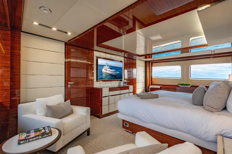 Allora Yacht Photos Pics Luxurious bedroom interior of 2011 Benetti Classic 121 yacht with elegant wood finishes.