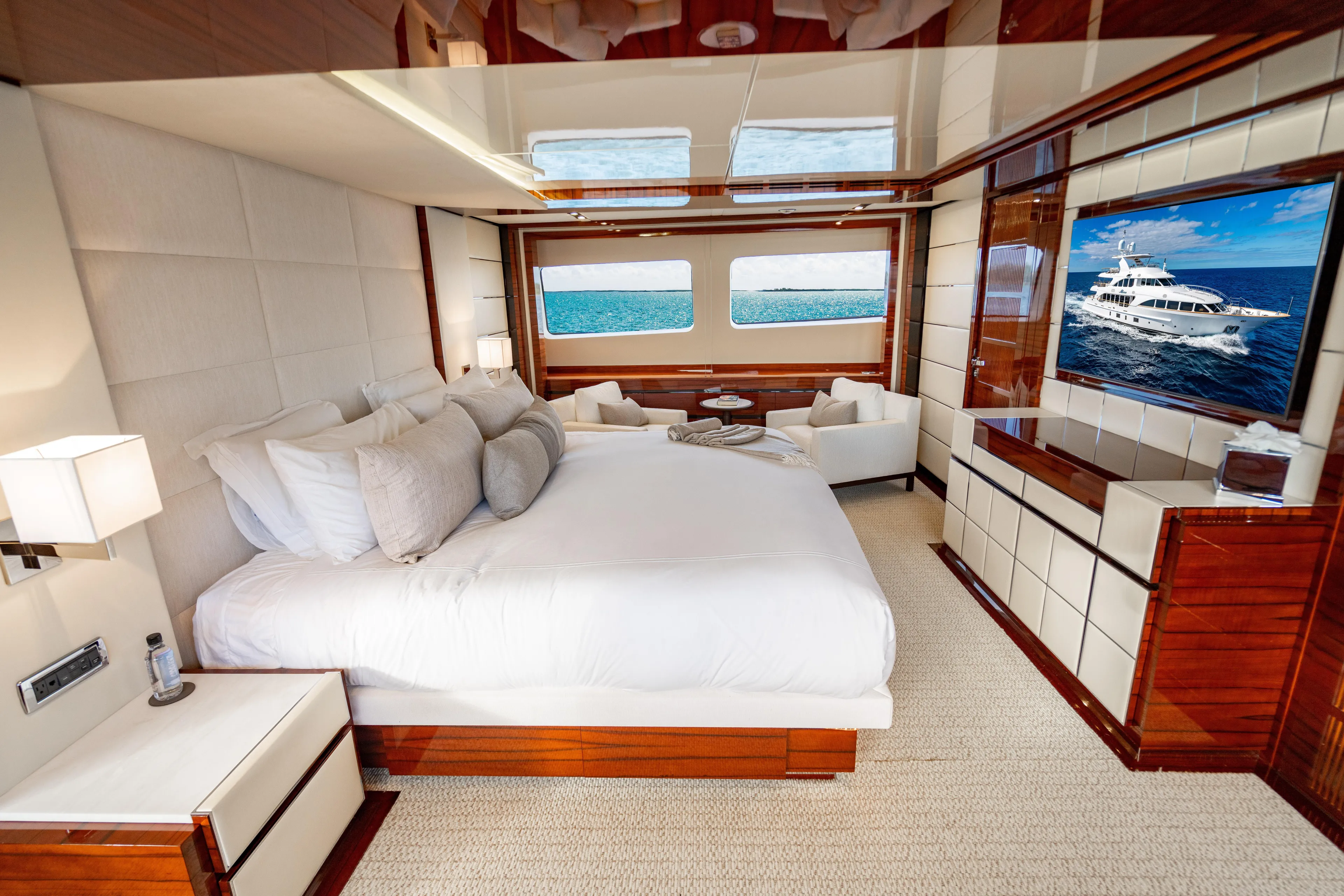 Allora Yacht Photos Pics Luxurious bedroom interior on 2011 Benetti Classic 121 yacht, featuring elegant decor and ocean view.