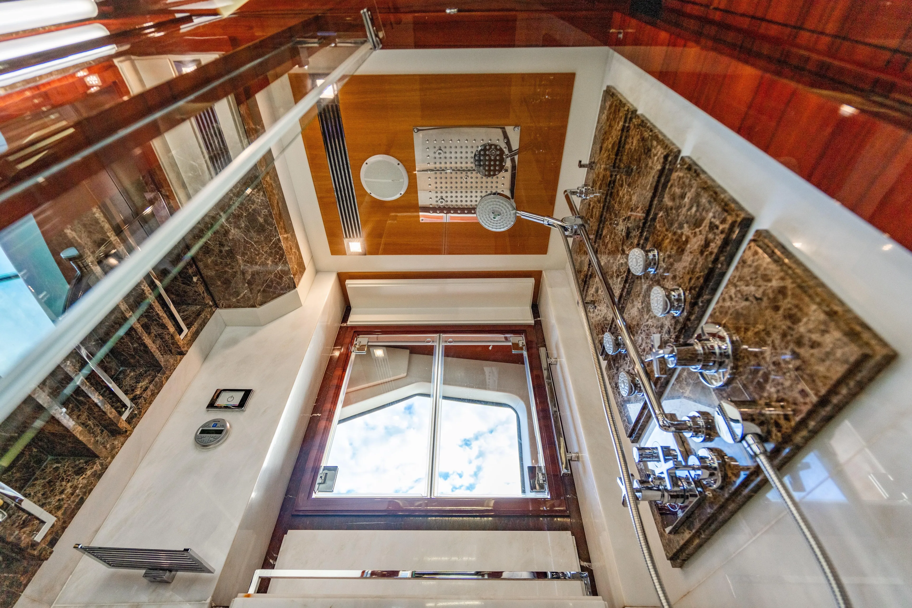 Allora Yacht Photos Pics Luxurious shower interior on 2011 Benetti Classic 121 yacht, featuring marble and chrome fixtures.