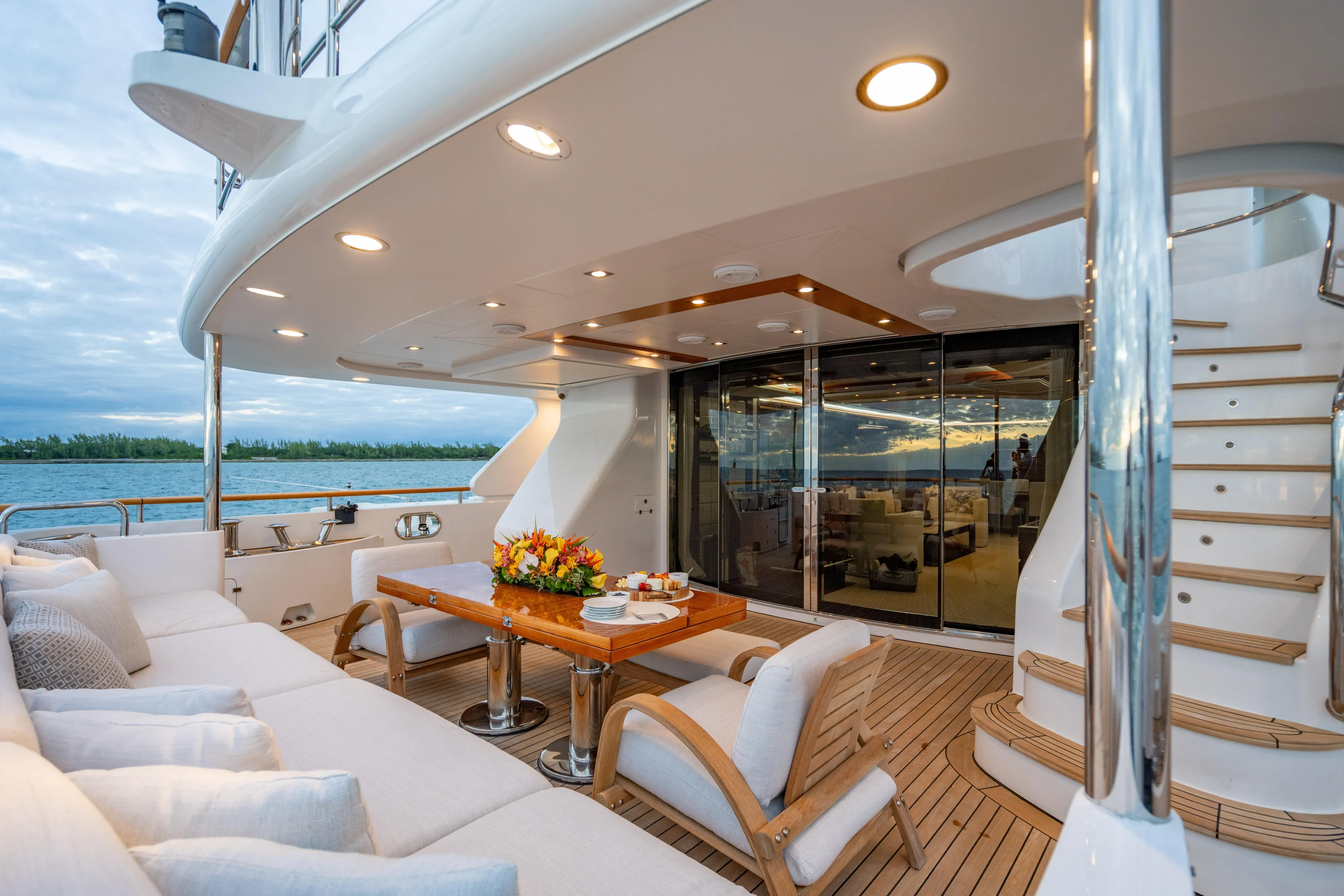 Allora Yacht Photos Pics Luxurious 2011 Benetti Classic 121 yacht deck with elegant seating and ocean view.