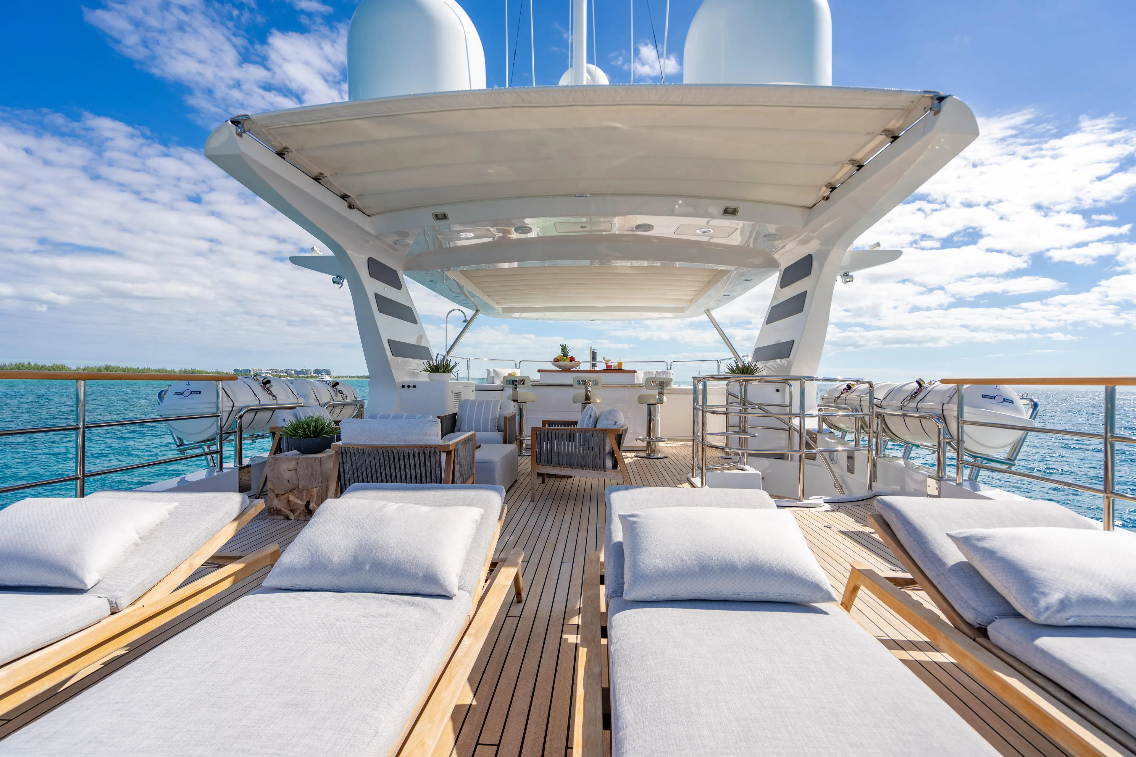 Allora Yacht Photos Pics Luxurious 2011 Benetti Classic 121 yacht deck with sun loungers and ocean view.