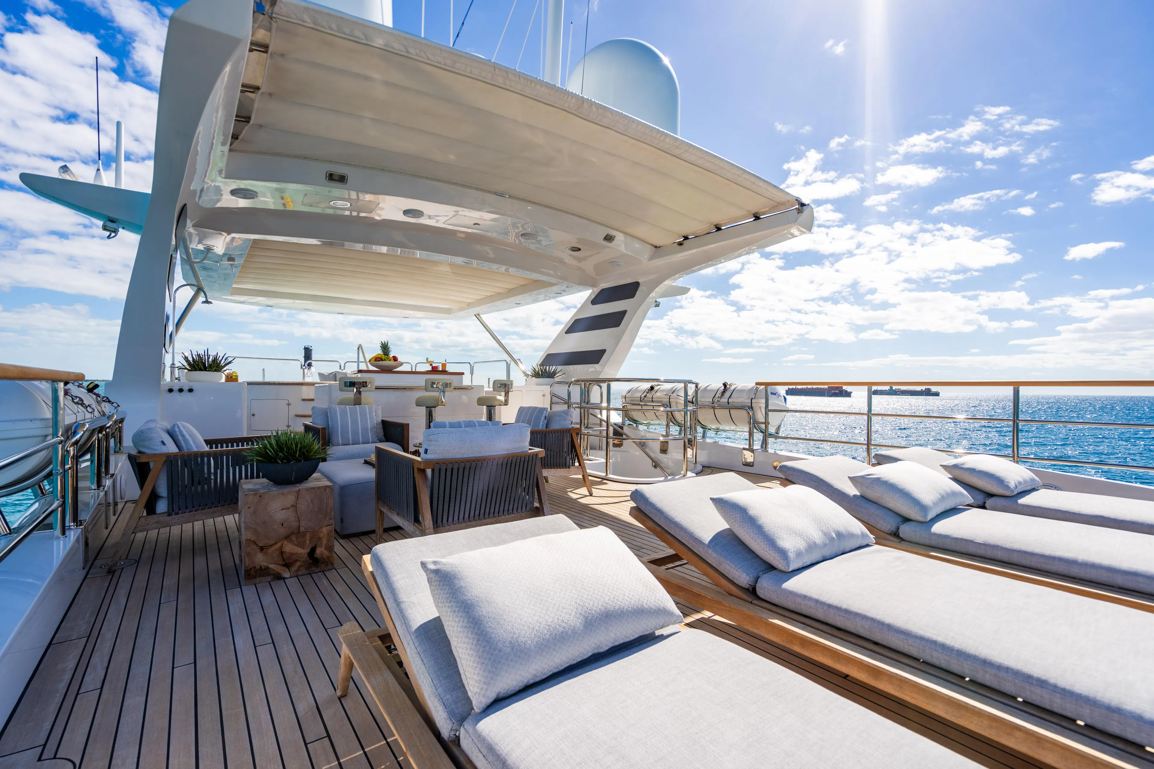 Allora Yacht Photos Pics Luxurious 2011 Benetti Classic 121 yacht deck with sun loungers and ocean view.