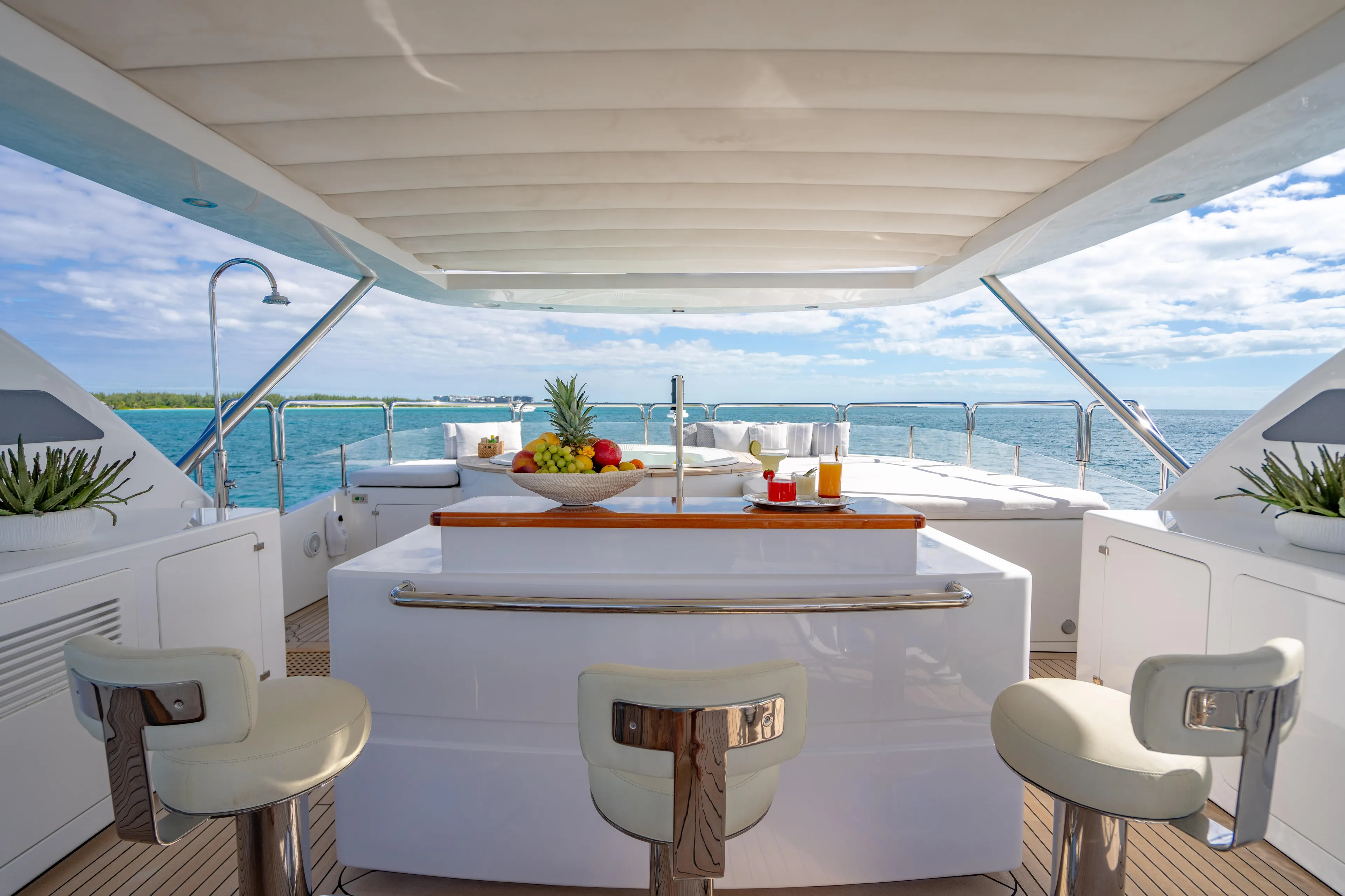 Allora Yacht Photos Pics Luxurious Benetti Classic 121 yacht deck with bar, seating, and ocean view, 2011 model.