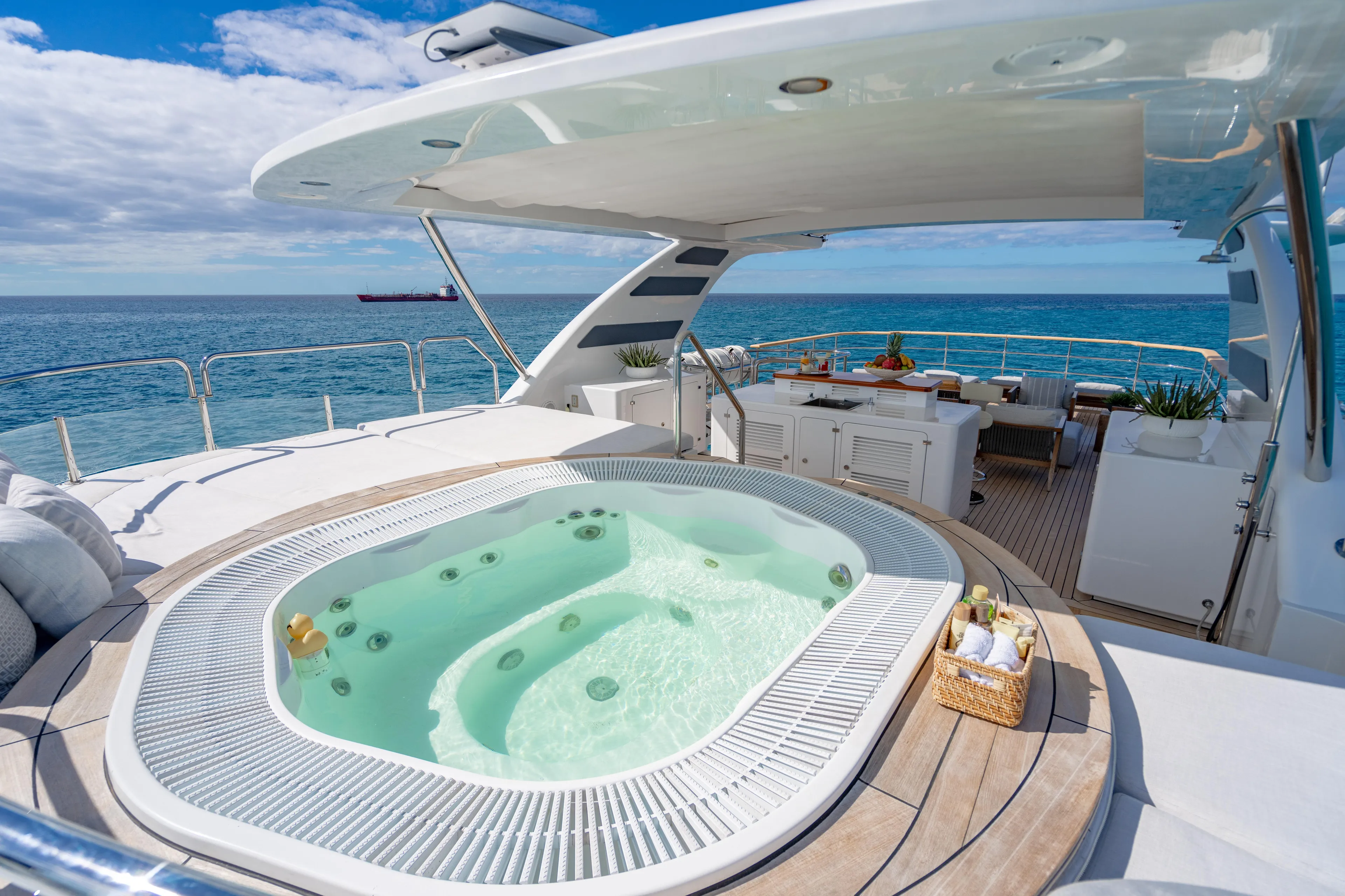 Allora Yacht Photos Pics Luxurious Benetti Classic 121 yacht deck with jacuzzi, ocean view, and elegant seating area.
