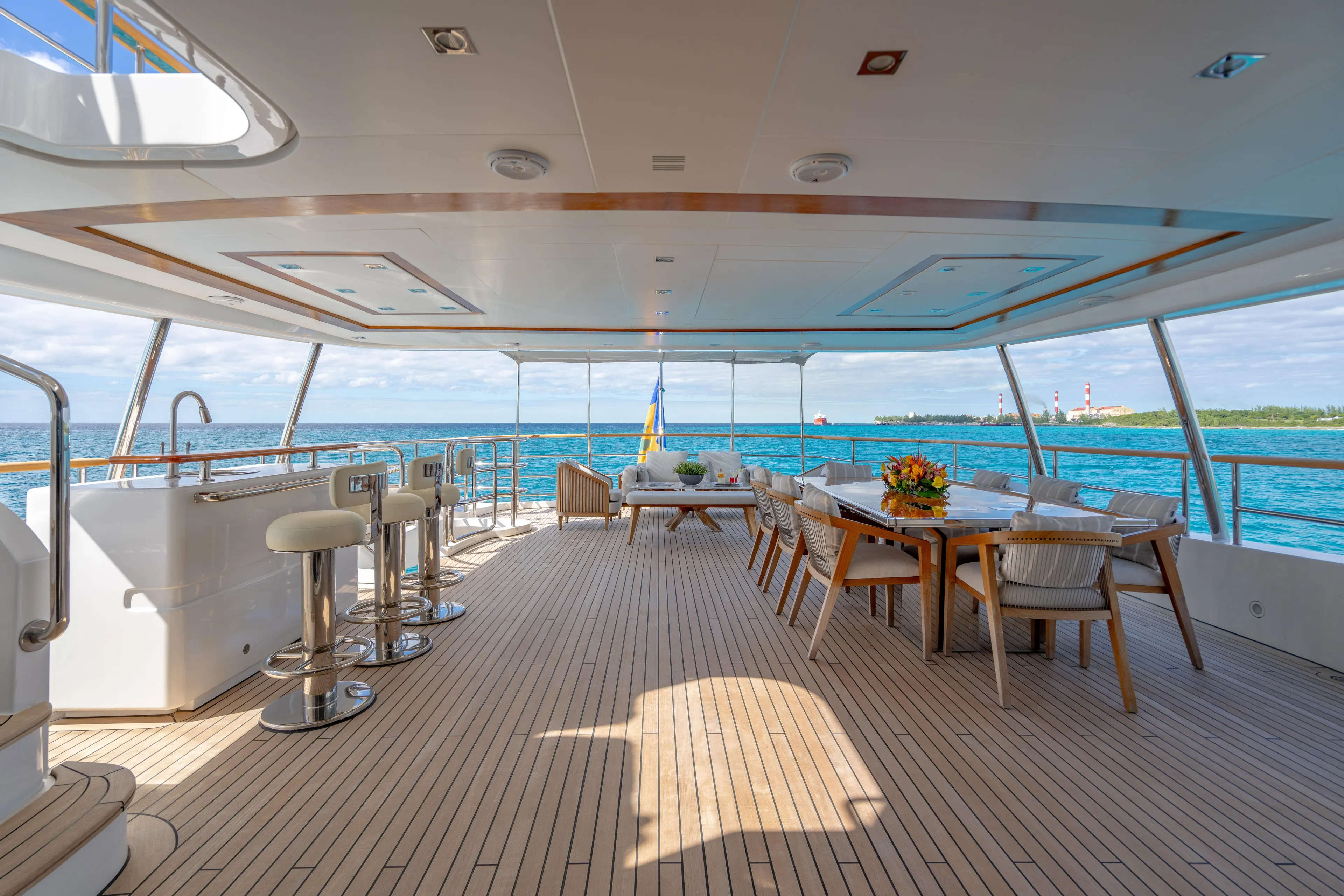 Allora Yacht Photos Pics Luxurious 2011 Benetti Classic 121 yacht deck with elegant seating and ocean view.
