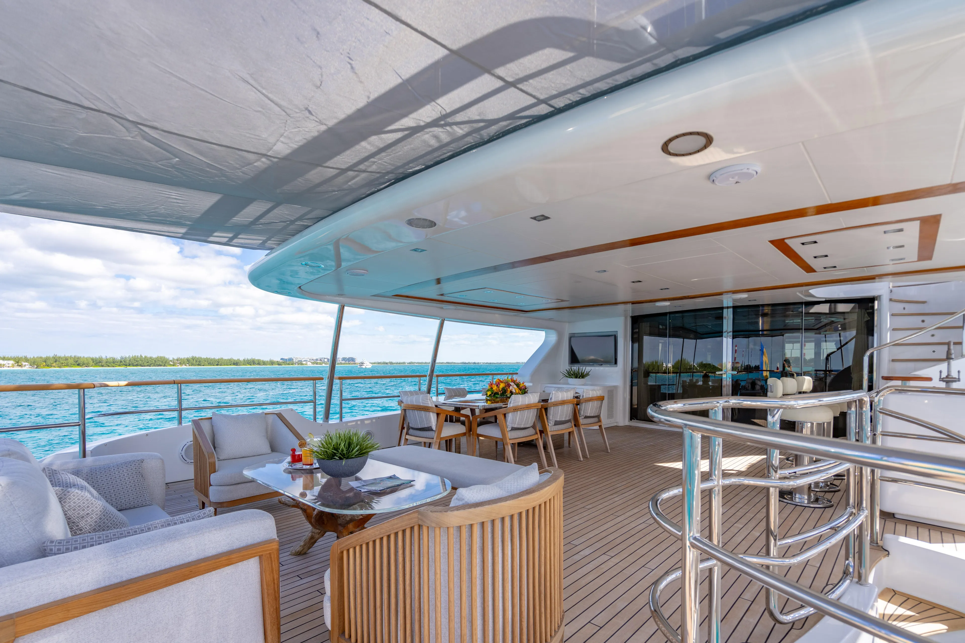 Allora Yacht Photos Pics Luxurious Benetti Classic 121 yacht deck with elegant seating and ocean view, 2011 model.