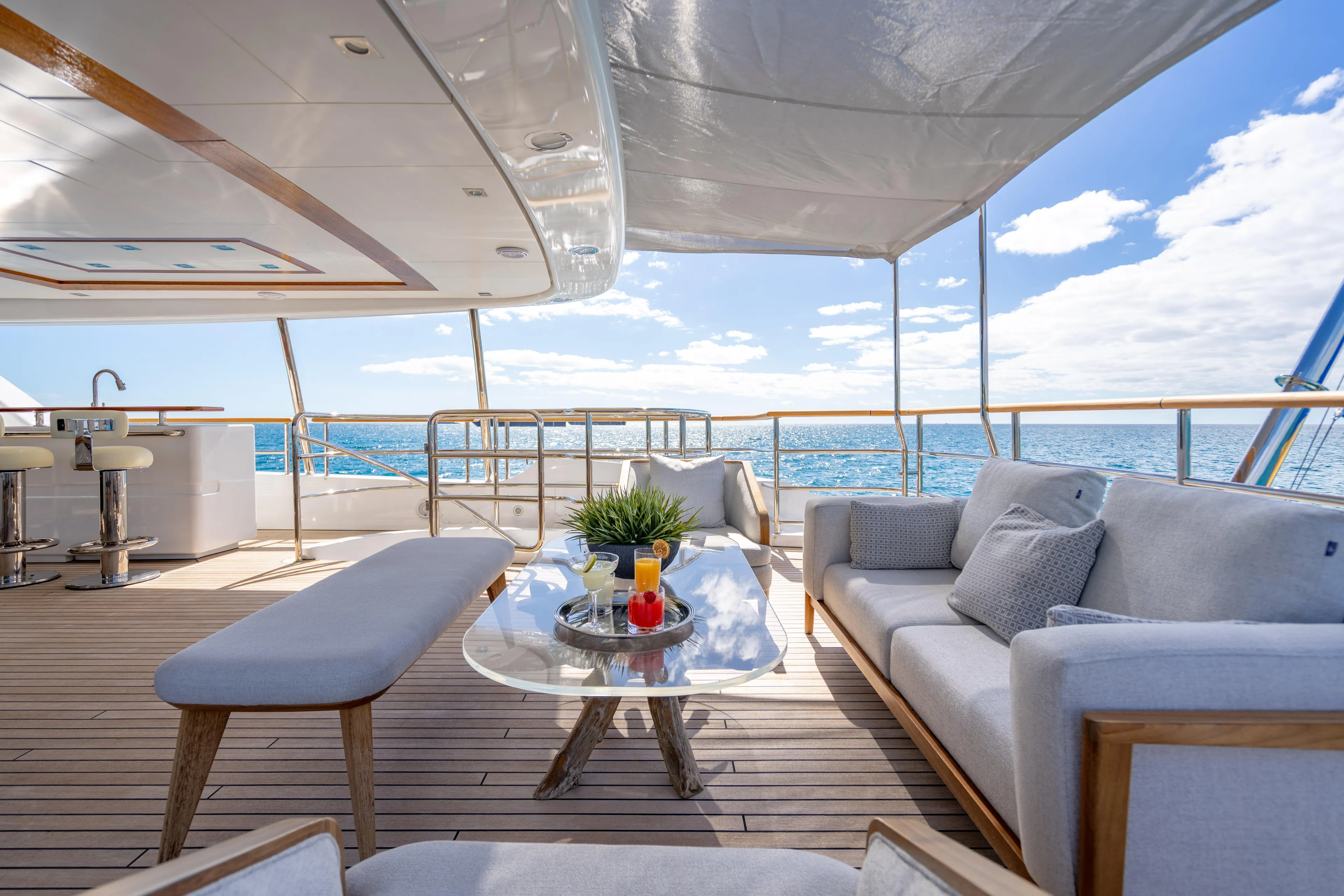 Allora Yacht Photos Pics Luxurious 2011 Benetti Classic 121 yacht deck with elegant seating and ocean view.