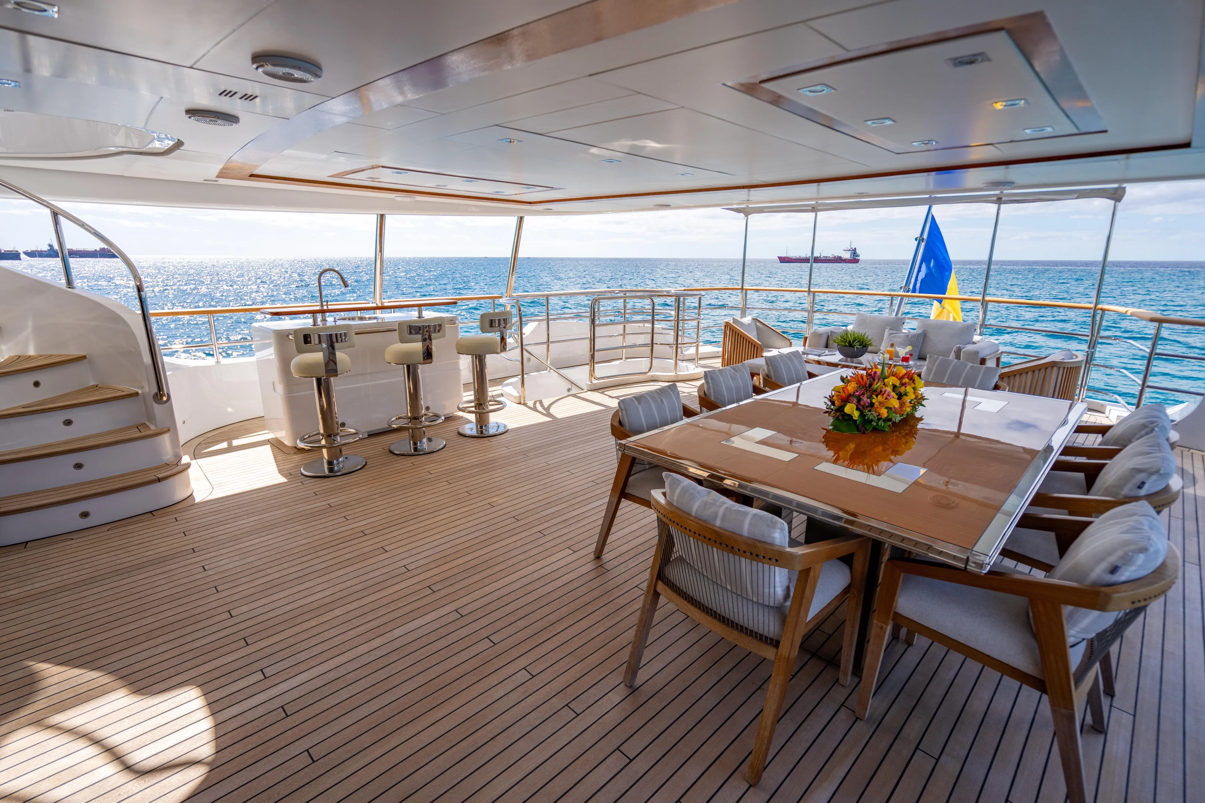 Allora Yacht Photos Pics Luxurious Benetti Classic 121 yacht deck with elegant seating and ocean view, 2011 model.