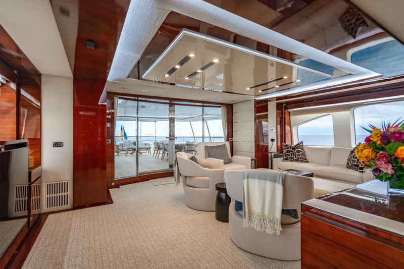 Allora Yacht Photos Pics Luxurious interior of 2011 Benetti Classic 121 yacht with elegant seating and ocean view.