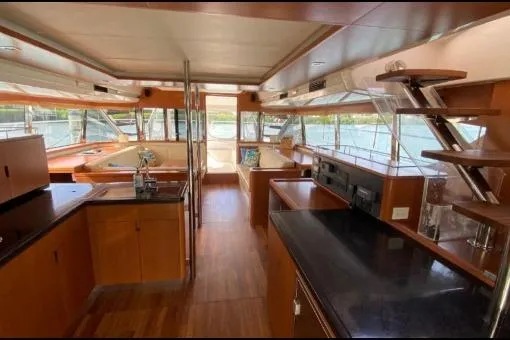 Kimberly Dawn Yacht Photos Pics Interior of 2014 Aquila 48 PC yacht with modern kitchen and panoramic windows.