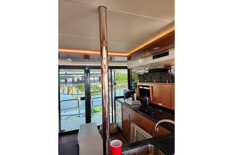 Kimberly Dawn Yacht Photos Pics Interior of 2014 Aquila 48 PC yacht with modern kitchen and scenic view.