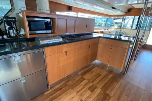 Kimberly Dawn Yacht Photos Pics Luxurious kitchen interior of 2014 Aquila 48 PC yacht with modern appliances.