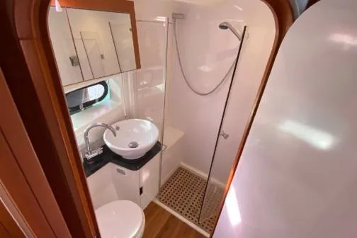 Kimberly Dawn Yacht Photos Pics Bathroom interior of 2014 Aquila 48 PC yacht with modern fixtures and shower.