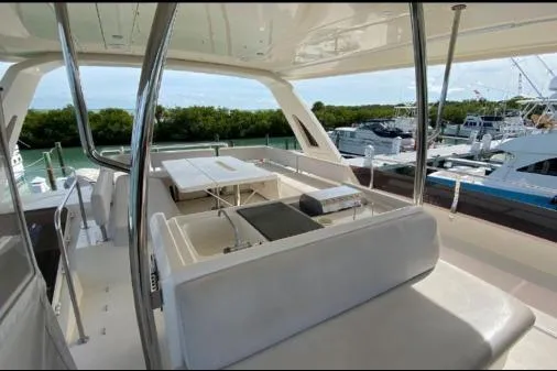 Kimberly Dawn Yacht Photos Pics Luxurious 2014 Aquila 48 PC yacht interior with spacious seating and scenic marina view.