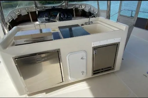 Kimberly Dawn Yacht Photos Pics Outdoor kitchen on 2014 Aquila 48 PC yacht with stainless steel appliances.