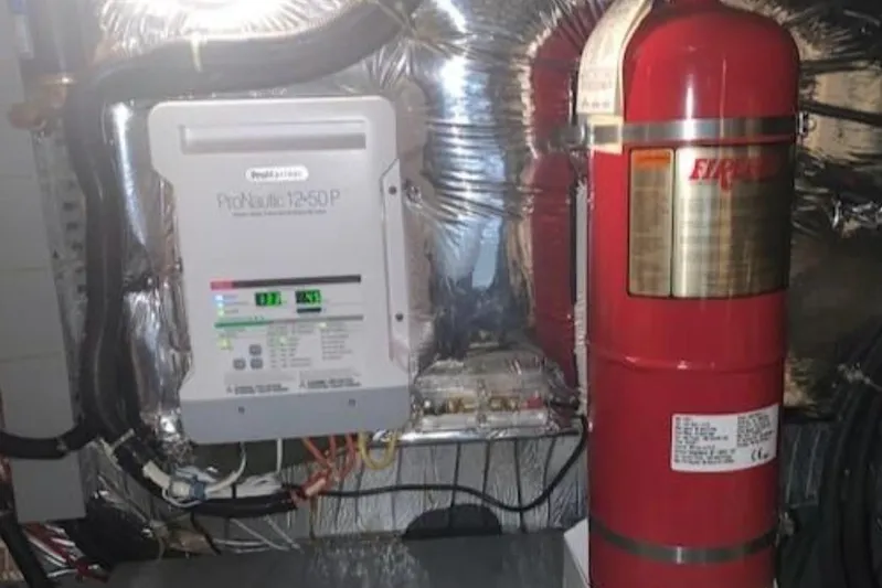  Yacht Photos Pics Engine room of 1994 Carver 440 Aft Cabin Motor Yacht with fire suppression system.