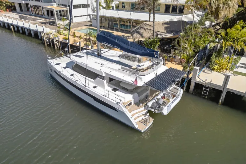  Yacht Photos Pics Luxury Leopard 50 catamaran docked, featuring solar panels and spacious deck, 2021 model.