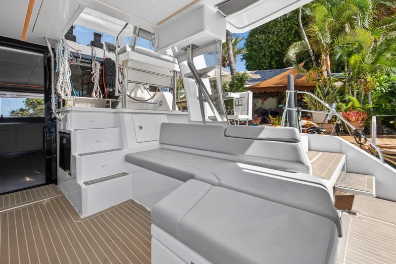  Yacht Photos Pics Luxurious 2021 Leopard 50 yacht interior with modern seating and tropical backdrop.