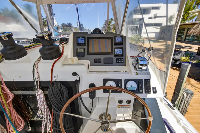  Yacht Photos Pics Helm of 2021 Leopard 50 yacht with navigation instruments and steering wheel.