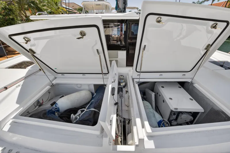  Yacht Photos Pics Open storage compartments on a 2021 Leopard 50 yacht, showcasing interior equipment and gear.