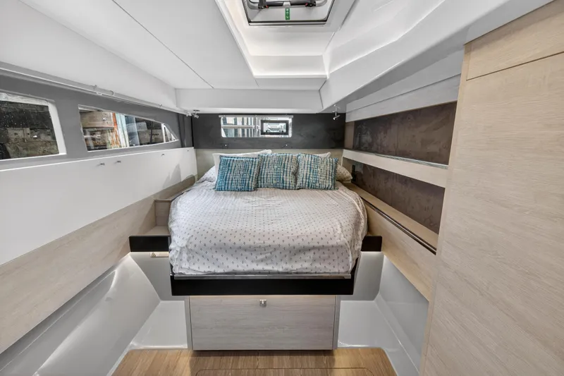  Yacht Photos Pics Luxurious cabin interior of 2021 Leopard 50 yacht with cozy bed and modern design.