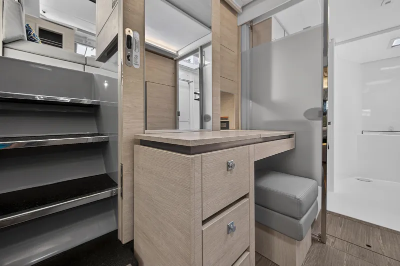  Yacht Photos Pics Modern interior of 2021 Leopard 50 yacht with sleek stairs and elegant cabinetry.