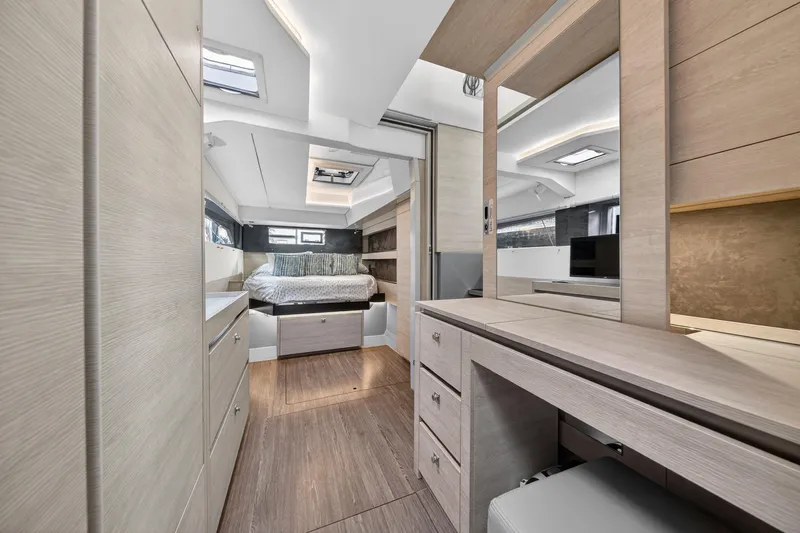  Yacht Photos Pics Luxurious interior of 2021 Leopard 50 yacht featuring modern bedroom and elegant wood finishes.