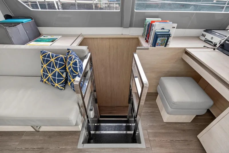  Yacht Photos Pics Modern Leopard 50 yacht interior with stairs, cushions, and books, 2021 model.