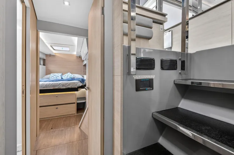  Yacht Photos Pics Modern interior of 2021 Leopard 50 yacht featuring bedroom and sleek design elements.