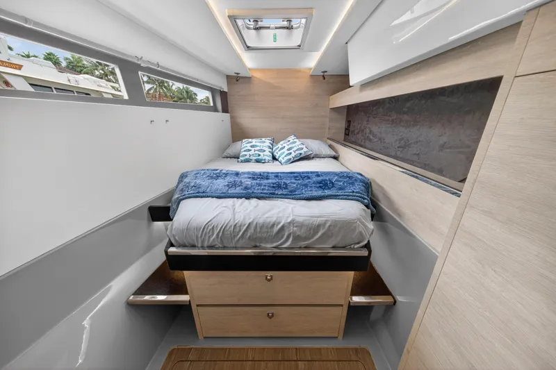  Yacht Photos Pics Luxurious cabin interior of 2021 Leopard 50 yacht with cozy bed and modern design.