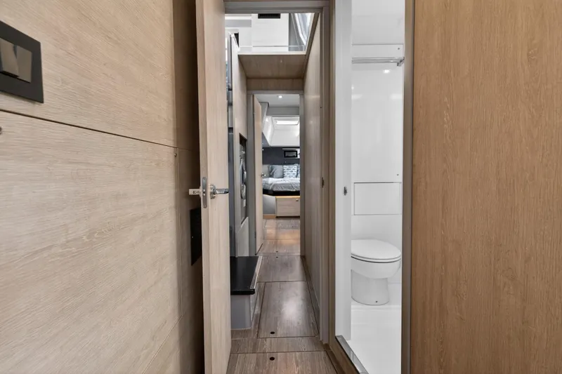  Yacht Photos Pics Interior view of 2021 Leopard 50 yacht, featuring modern bathroom and cozy bedroom.