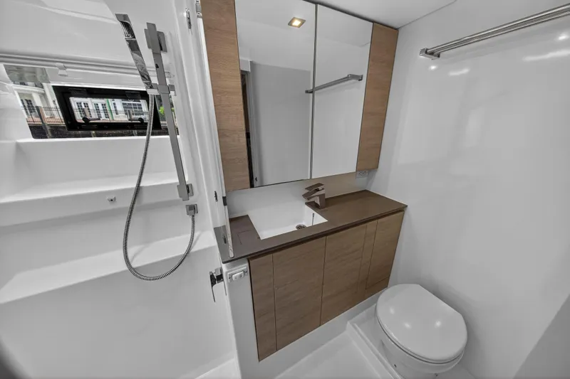  Yacht Photos Pics Modern bathroom in 2021 Leopard 50 yacht with sleek fixtures and wood accents.