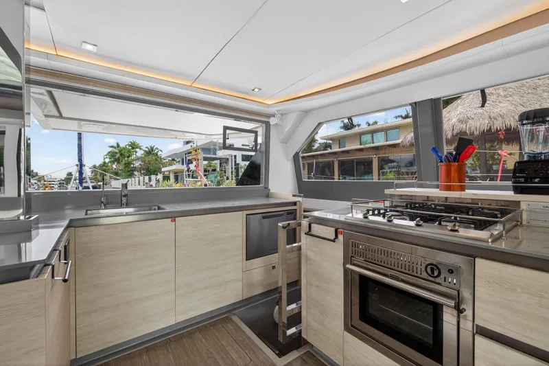  Yacht Photos Pics Modern kitchen interior on a 2021 Leopard 50 yacht, featuring sleek appliances and ample natural light.