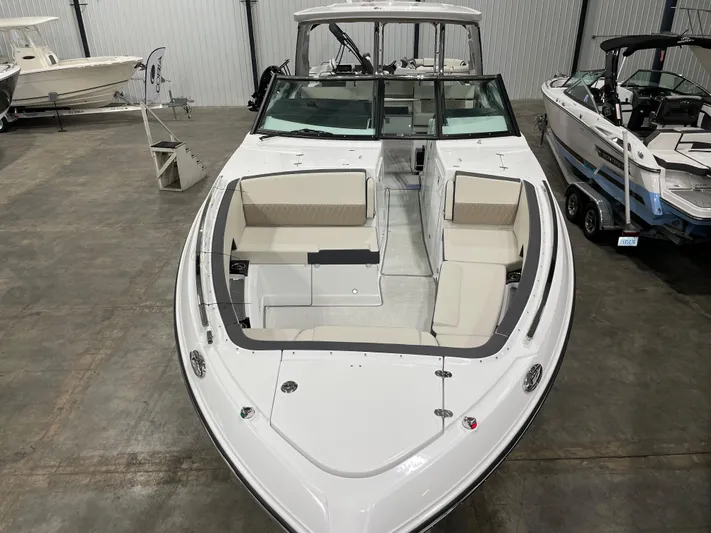 Livin Life Yacht Photos Pics 2023 Monterey 378SS Super Sport boat with spacious seating in a showroom.