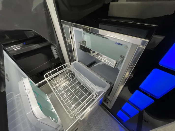 Livin Life Yacht Photos Pics 2023 Monterey 378SS Super Sport interior with open stainless steel drawer and blue LED lighting.