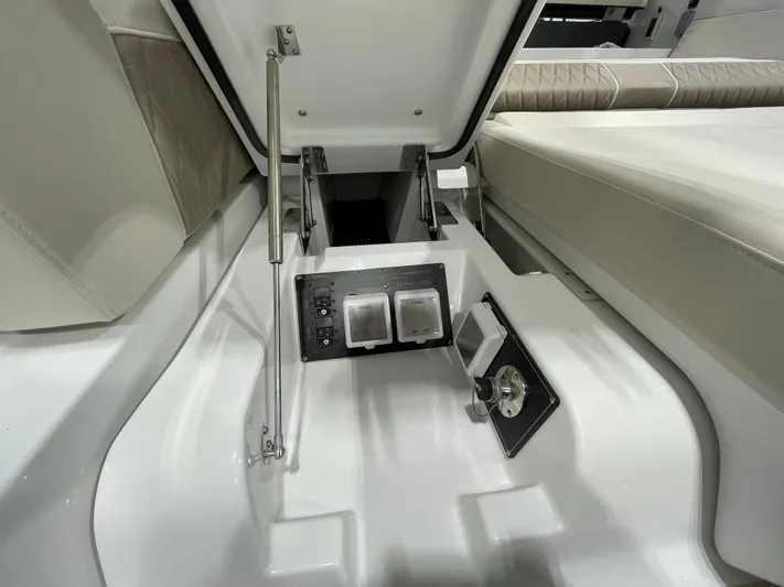 Livin Life Yacht Photos Pics 2023 Monterey 378SS Super Sport boat interior storage compartment with control panel.